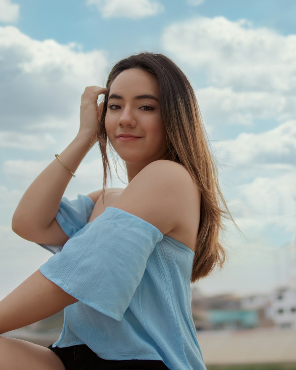 woman in blue off shoulder dress