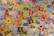 A collection of assorted Pokémon trading cards spread out, displaying various Pokémon characters, energies, and abilities. The cards vary in type, color, and design, showcasing different Pokémon species, stats, and features.