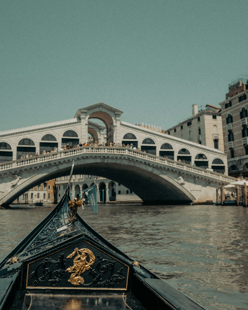 white and brown concrete bridge under blue sky during daytime