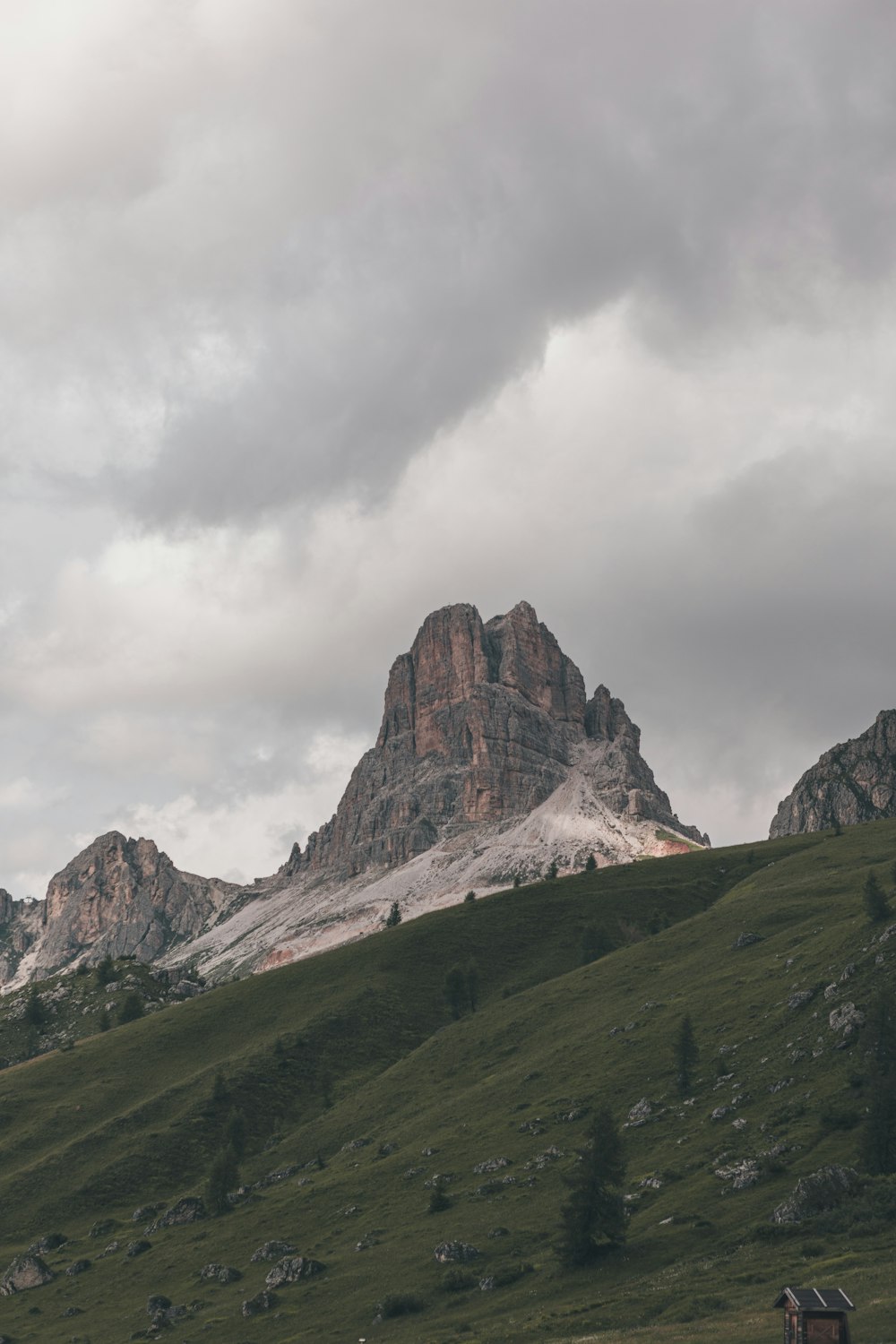 brown rocky mountain under white cloudy sky during daytime