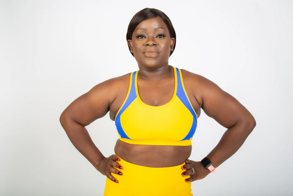 Woman wearing a yellow and blue colorblock sports bra