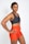 woman in black sports bra and red shorts