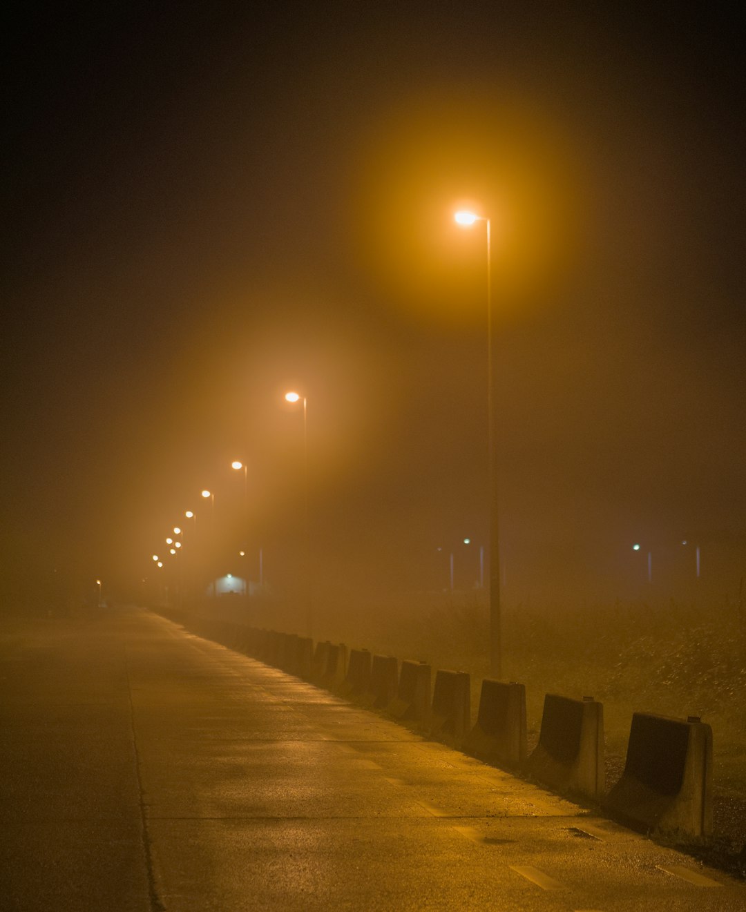gray concrete road during night time