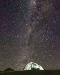white dome tent under starry night
