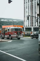 red and white fire truck on road during daytime