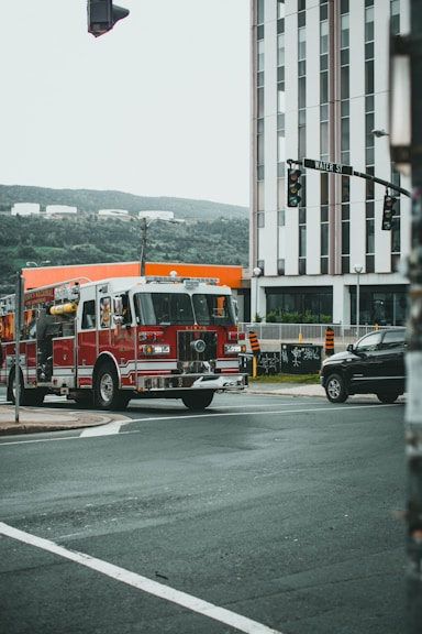 red and white fire truck on road during daytime
