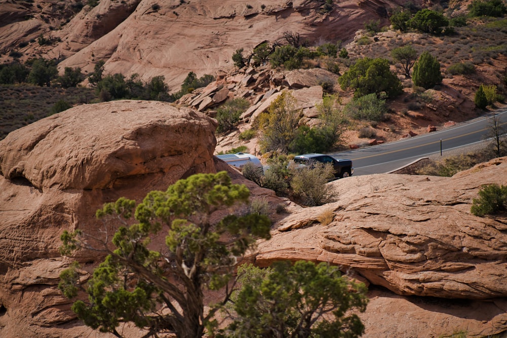 a car is driving down a mountain road