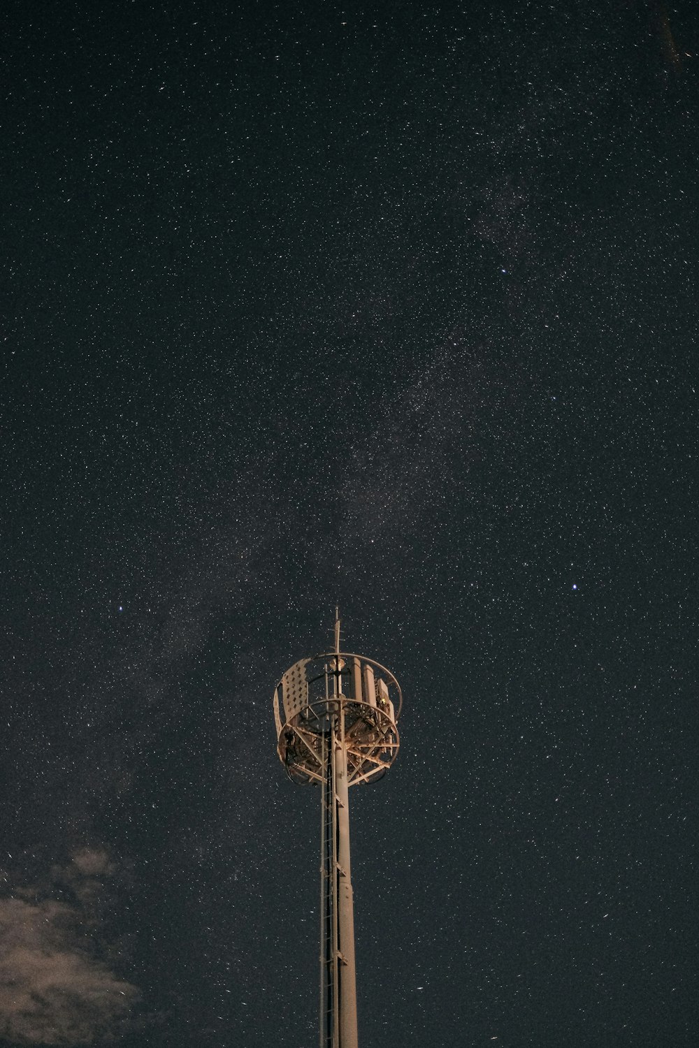 brown and white tower under starry night