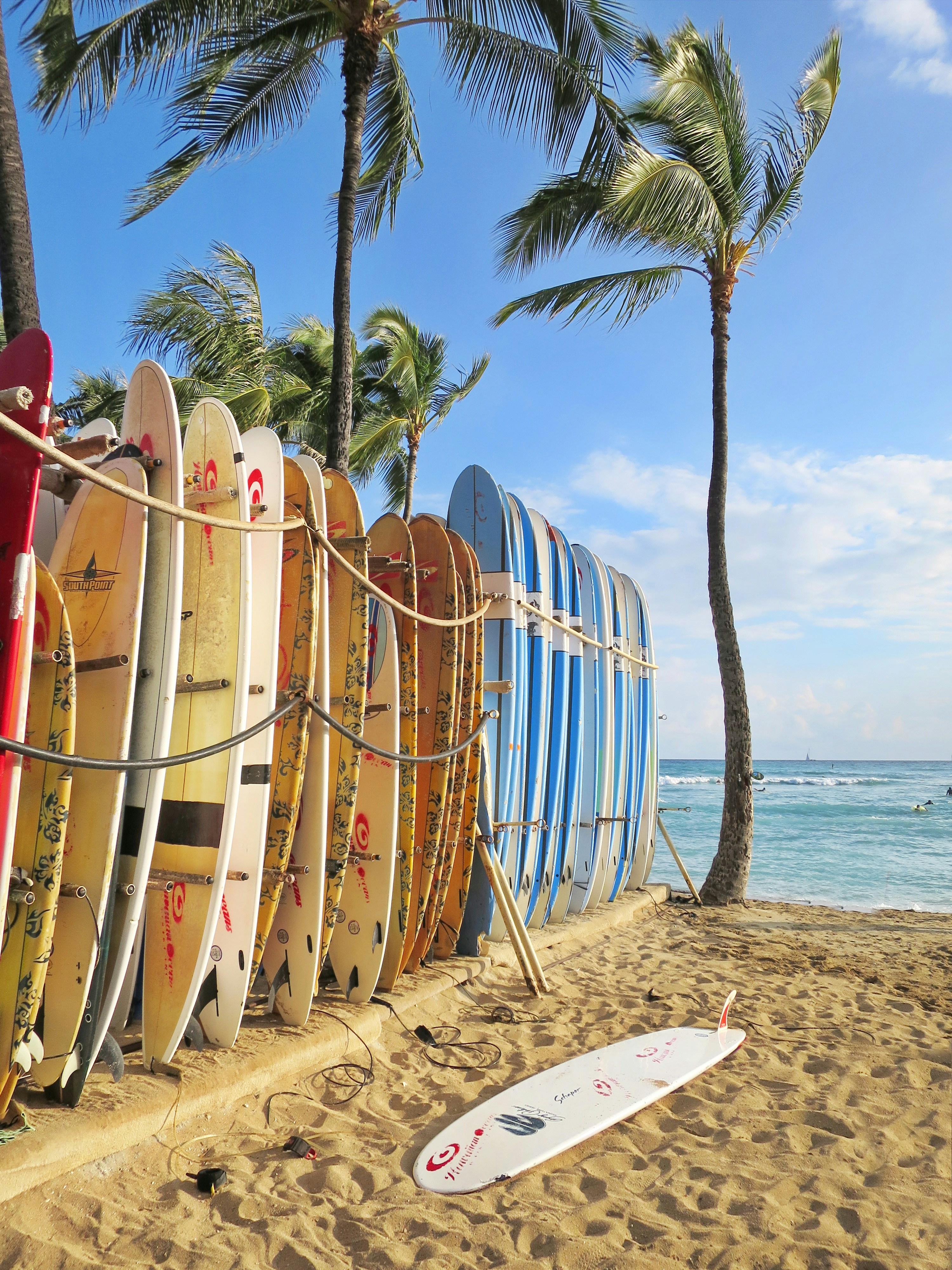 brown wooden boats on beach during daytime