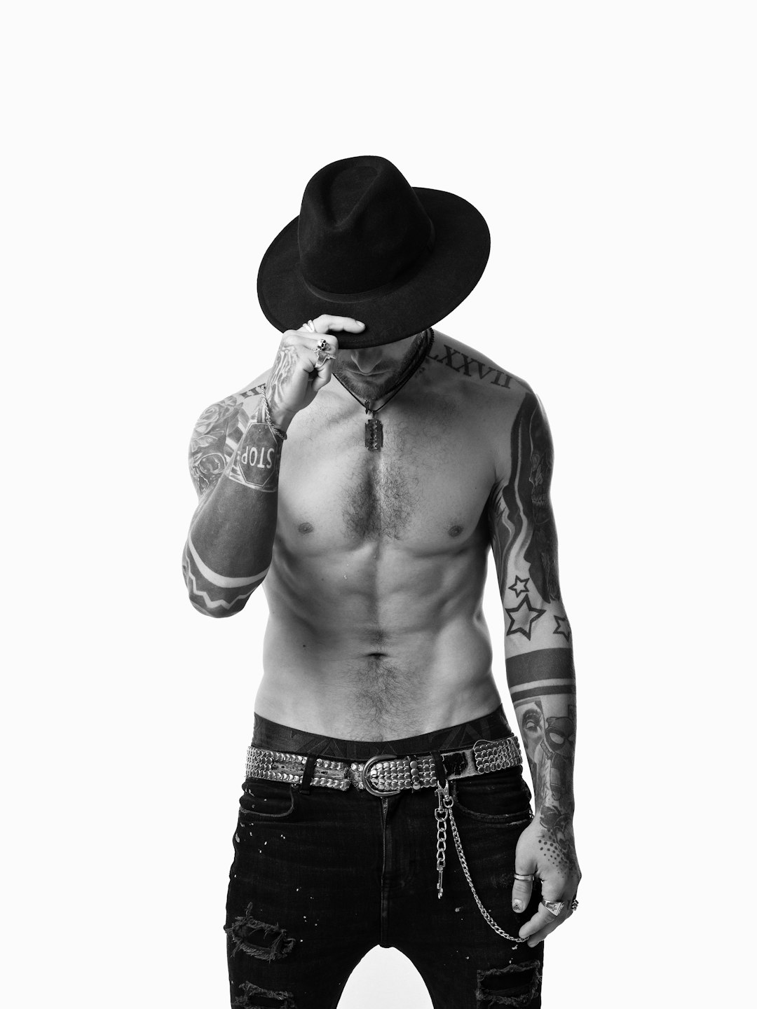 topless man wearing cowboy hat