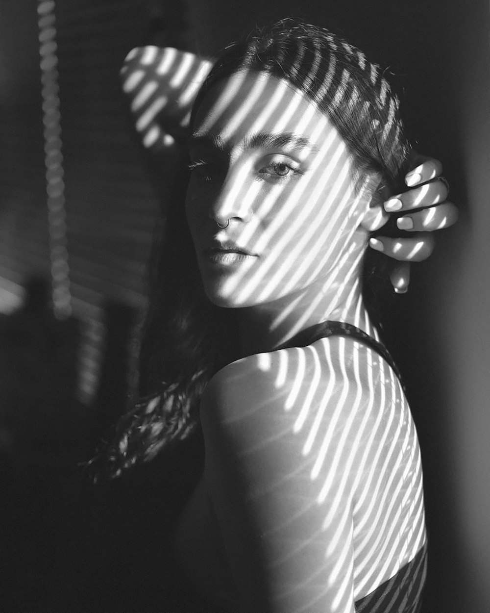 woman in white and black stripe shirt