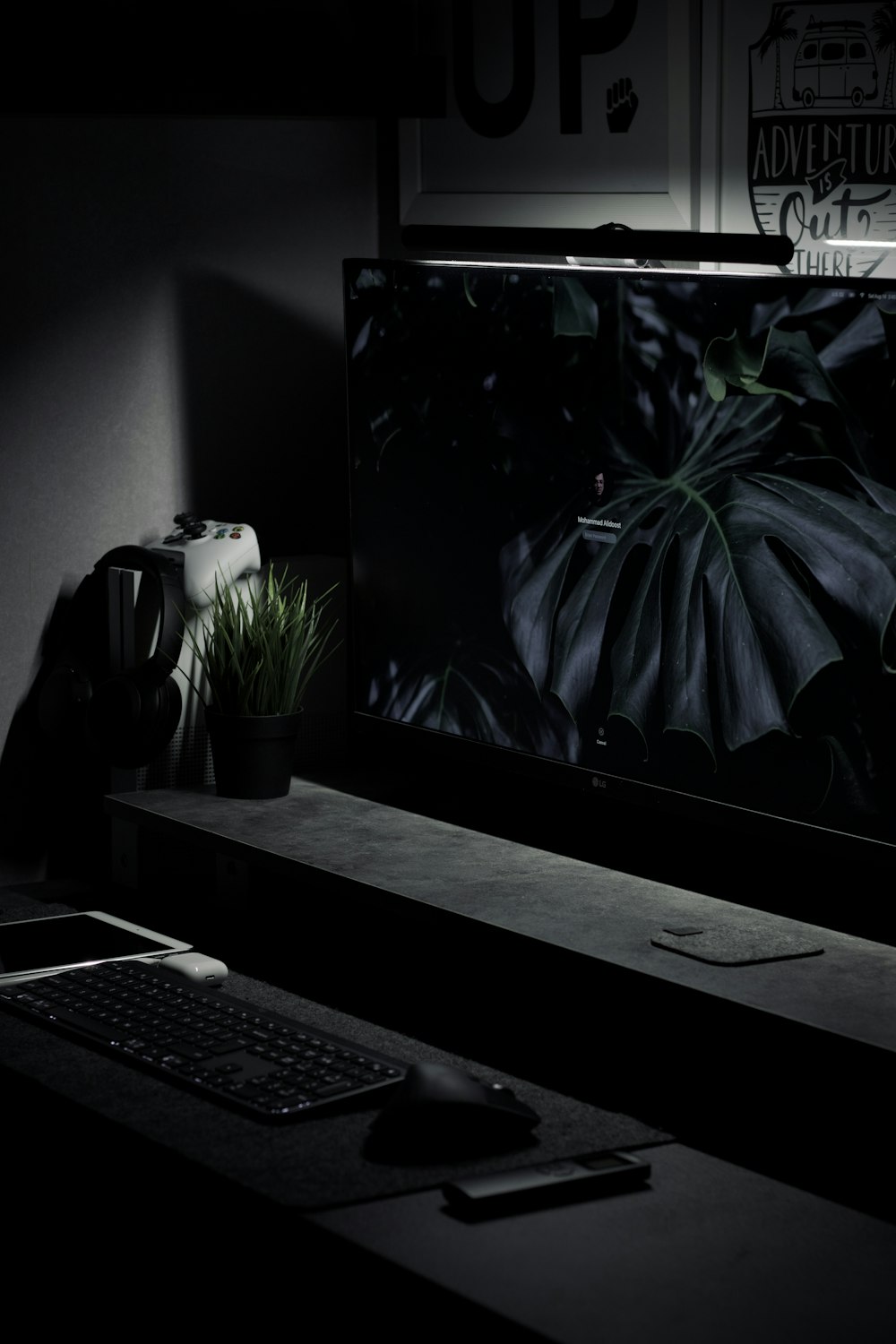 black computer keyboard beside black computer monitor