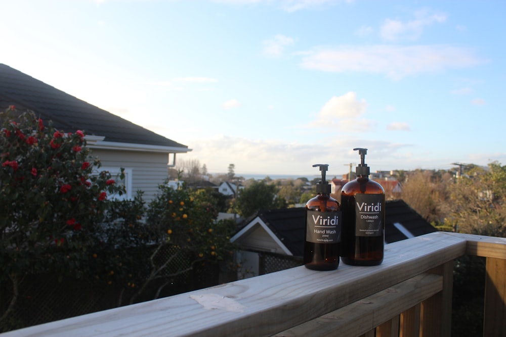 brown and black bottle on brown wooden table