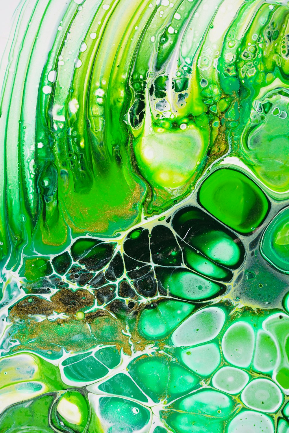 a close up of a green and white liquid