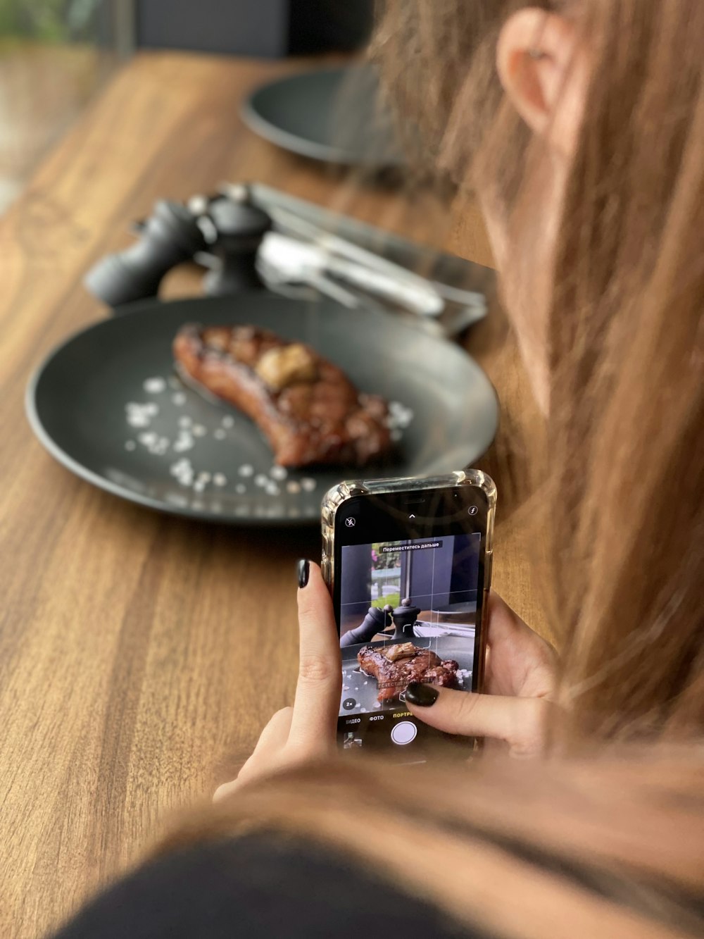 person holding black android smartphone