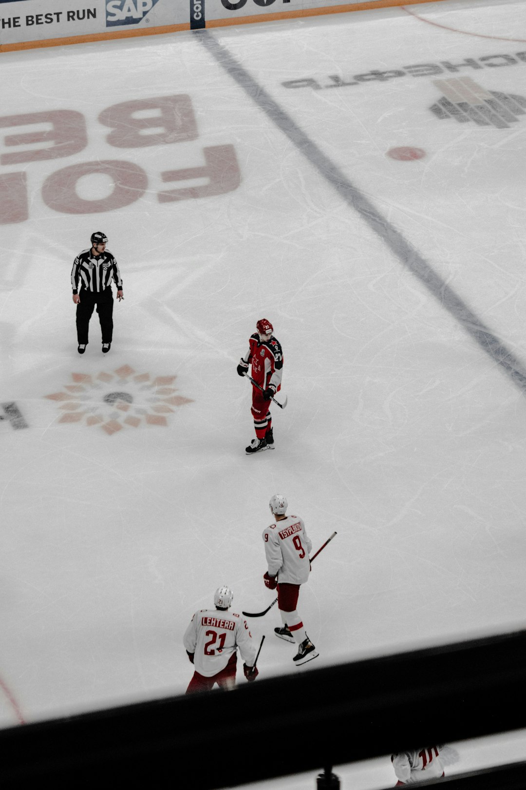 2 men playing ice hockey