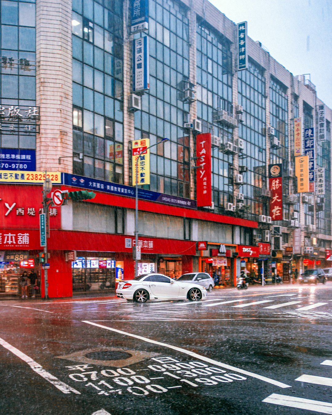 white coupe on road during daytime