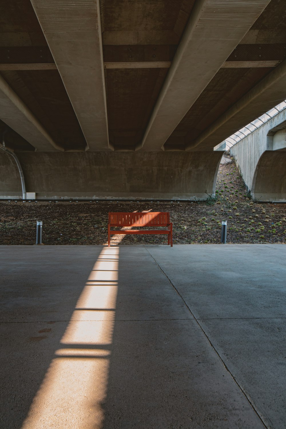 red and black road sign on gray concrete floor