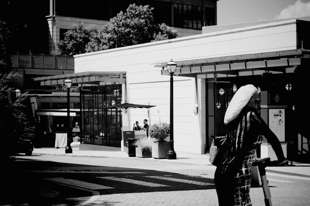 A vibrant urban street scene blending African cultural symbols with contemporary fashion elements.