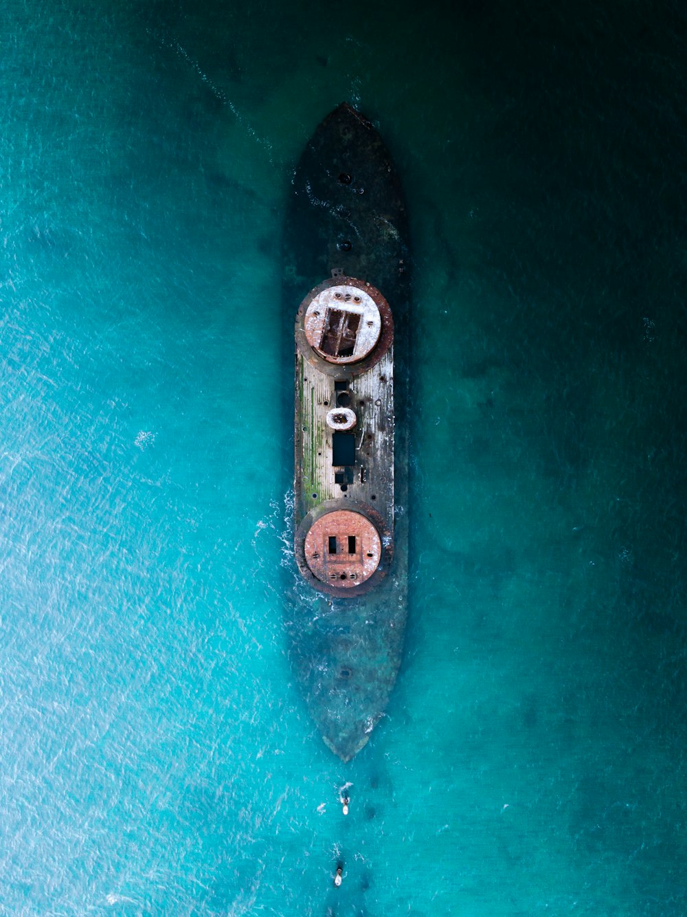 aerial view of white and black ship on sea during daytime