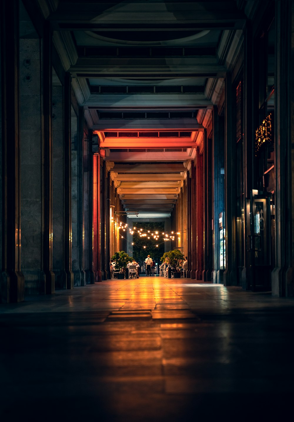 brown wooden hallway with yellow lights