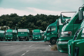 green truck on the road during daytime