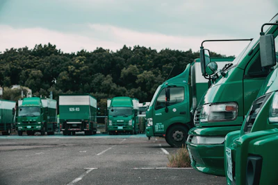 green truck on the road during daytime