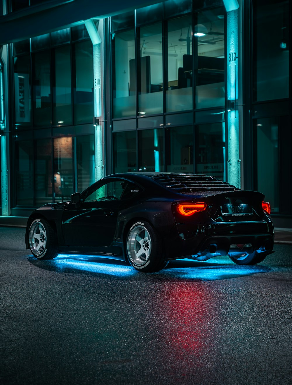 black bmw m 3 parked in front of building