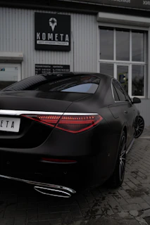 black porsche 911 parked in garage