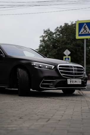black mercedes benz coupe on road during daytime