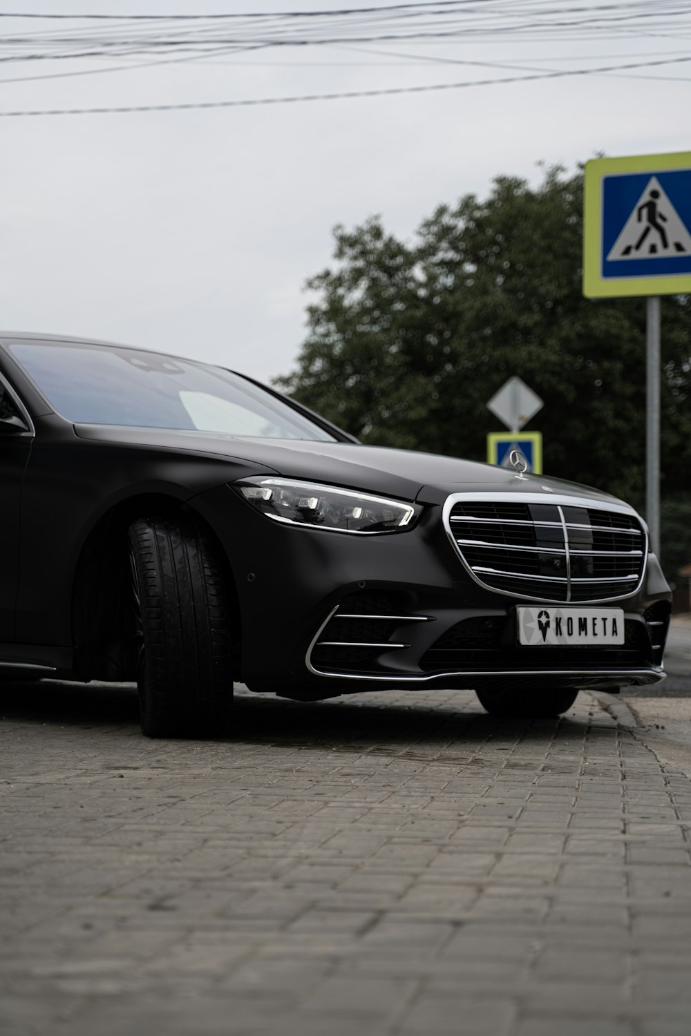 black mercedes benz coupe on road during daytime