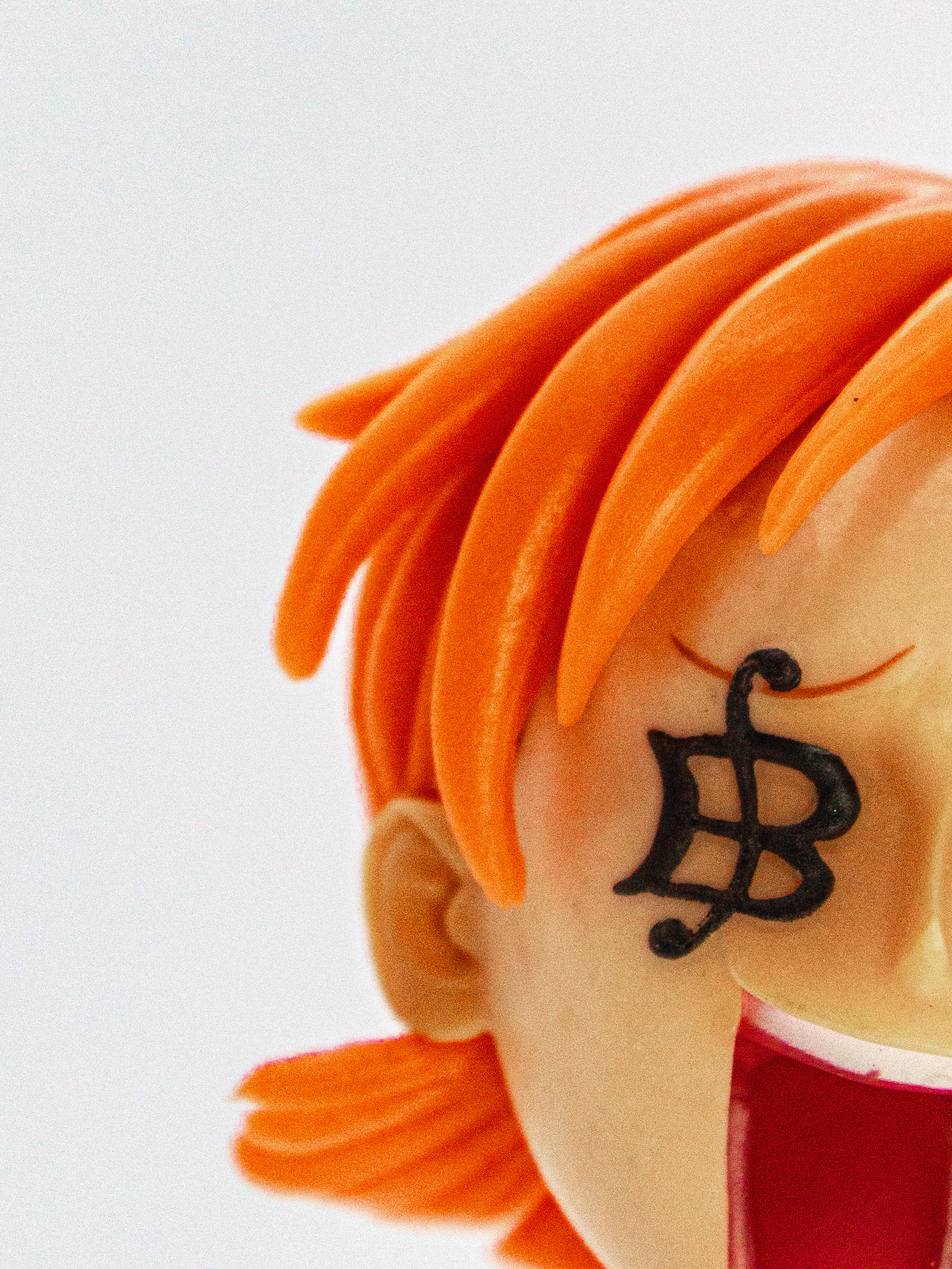 A high-resolution close-up of a handcrafted anime-inspired figurine with expressive features.