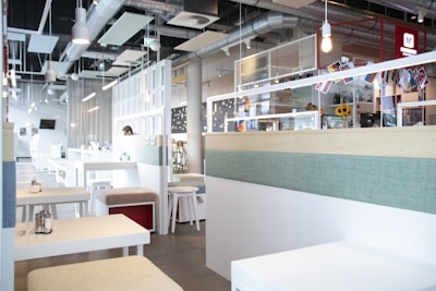 Bright and airy café interior with minimalist design and pastel accents reflecting freshness.