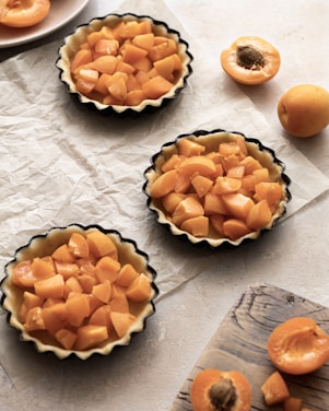 yellow and black round fruit on white table cloth