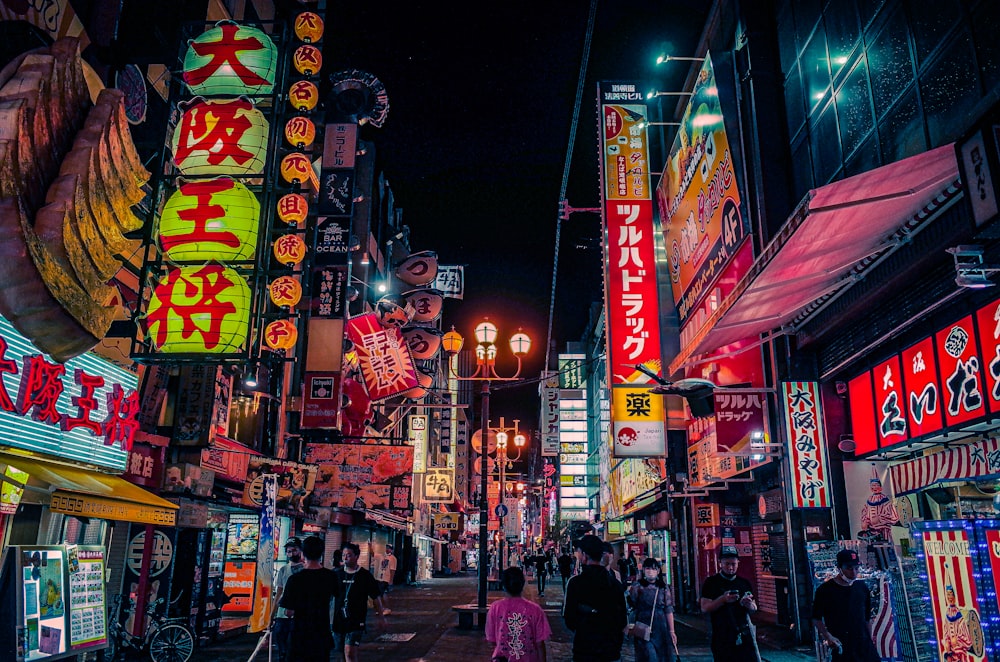 people walking on street during nighttime