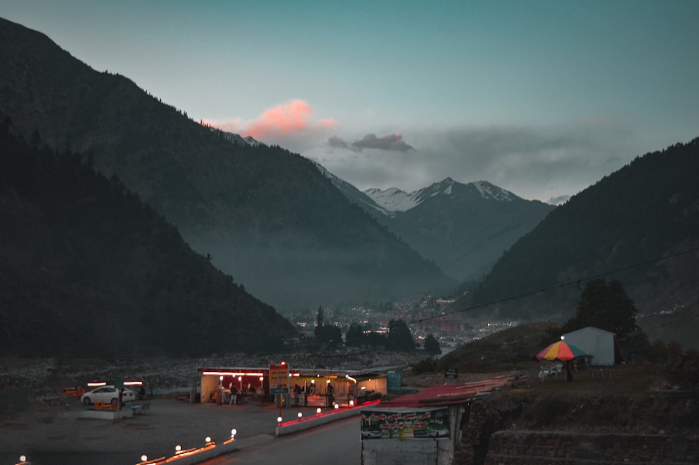 red and white houses near mountain during daytime