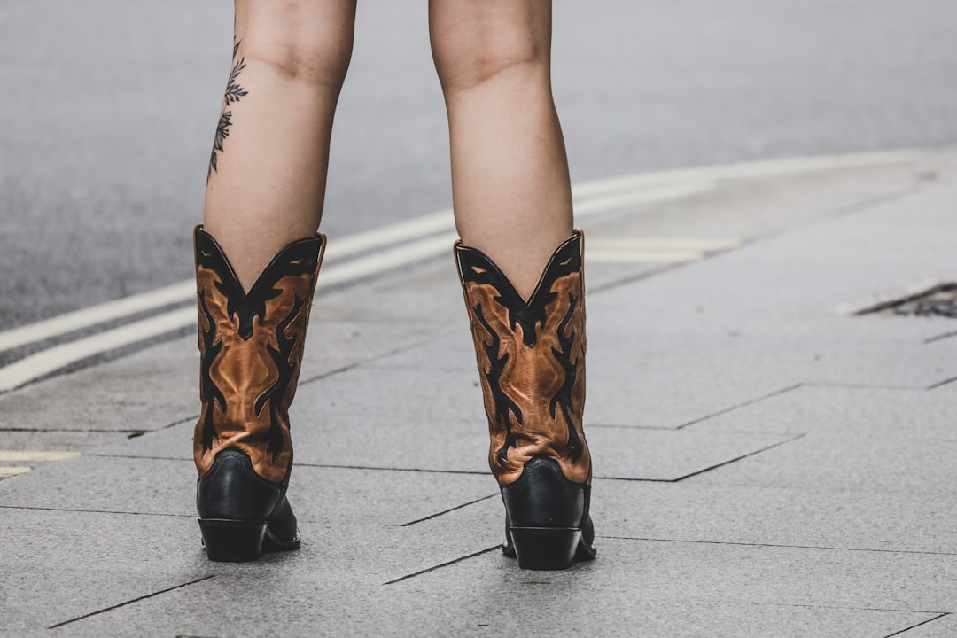 woman in brown leather boots