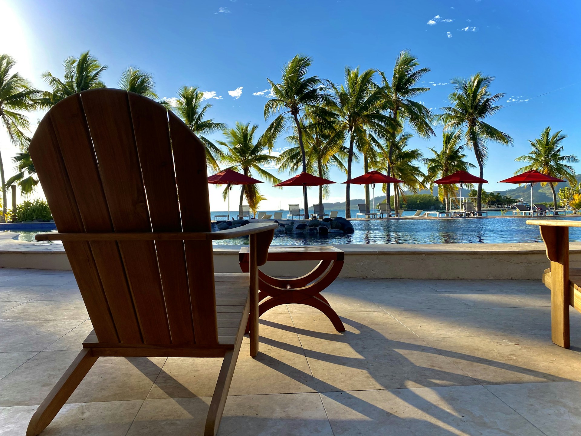 woman wearing yellow long-sleeved dress under white clouds and blue sky during daytime