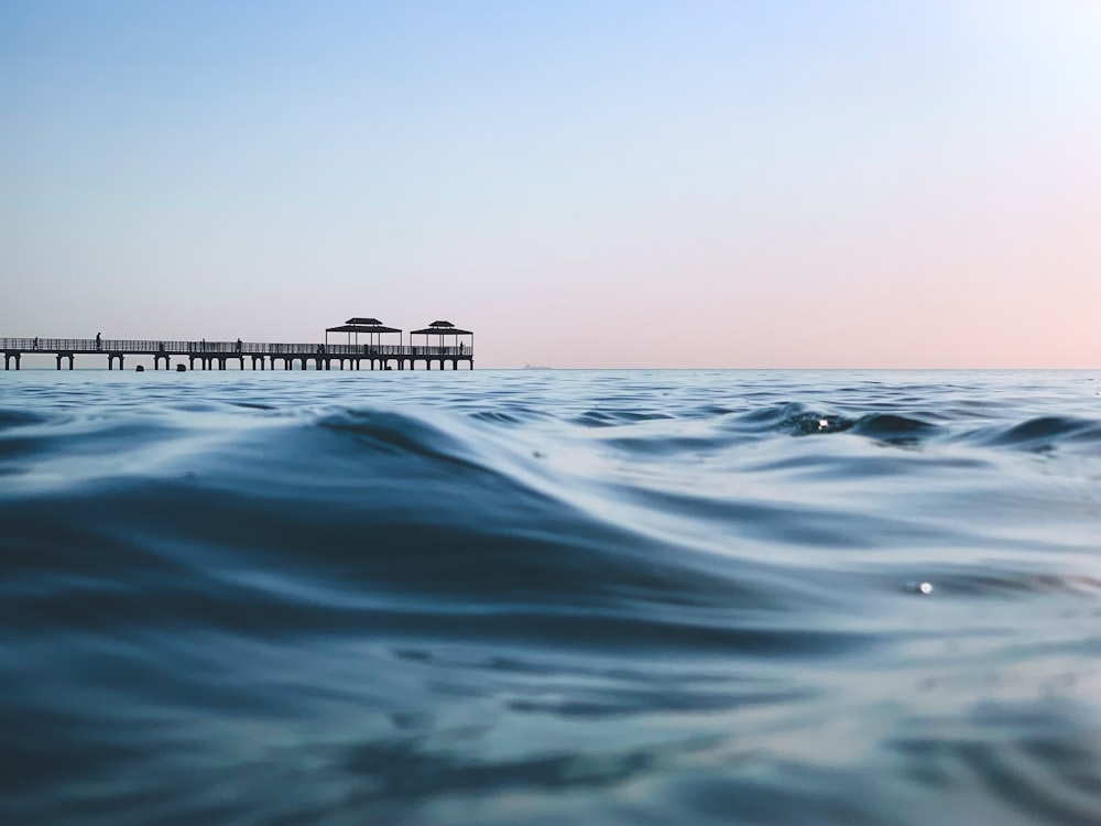 body of water under blue sky during daytime