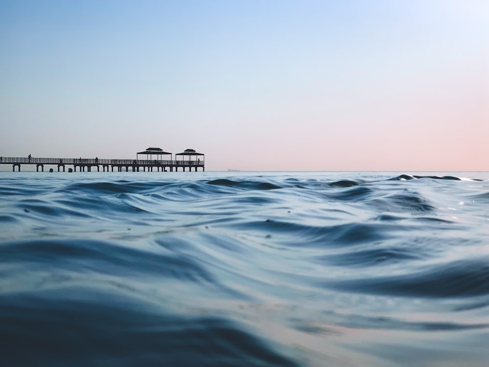 body of water under blue sky during daytime