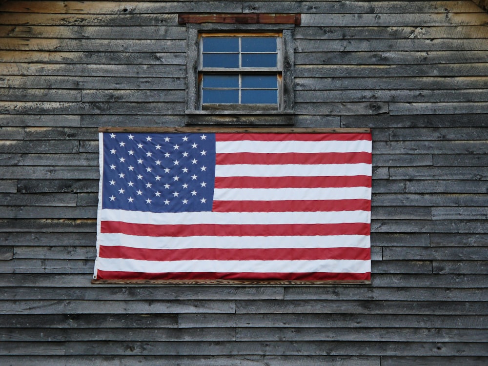 us a flag on brown wooden window