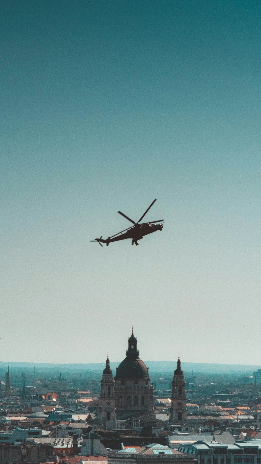 brown airplane flying in the sky during daytime