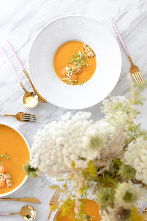 White rice with orange sauce on white ceramic plate