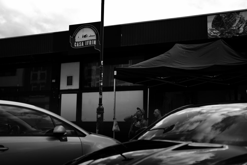 black car parked near store