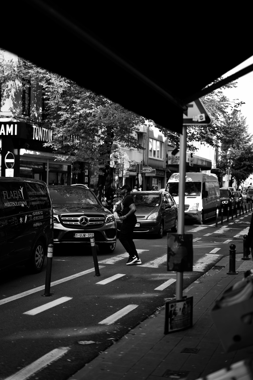 grayscale photo of cars on road