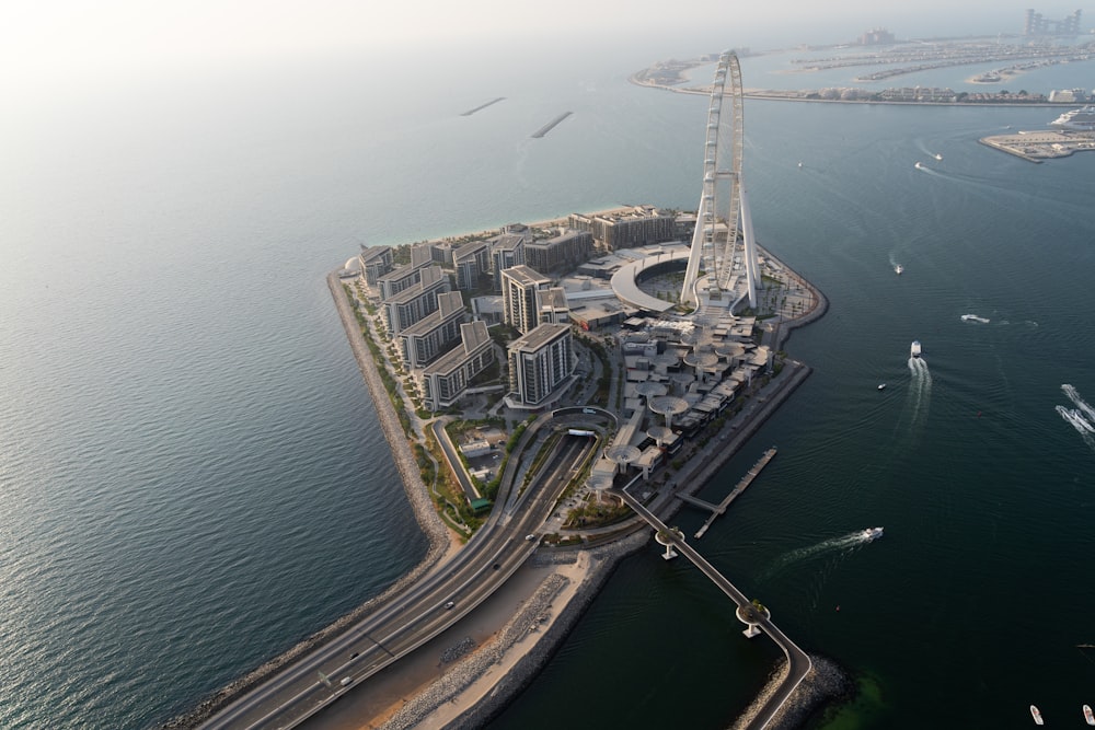 aerial view of city buildings near body of water during daytime