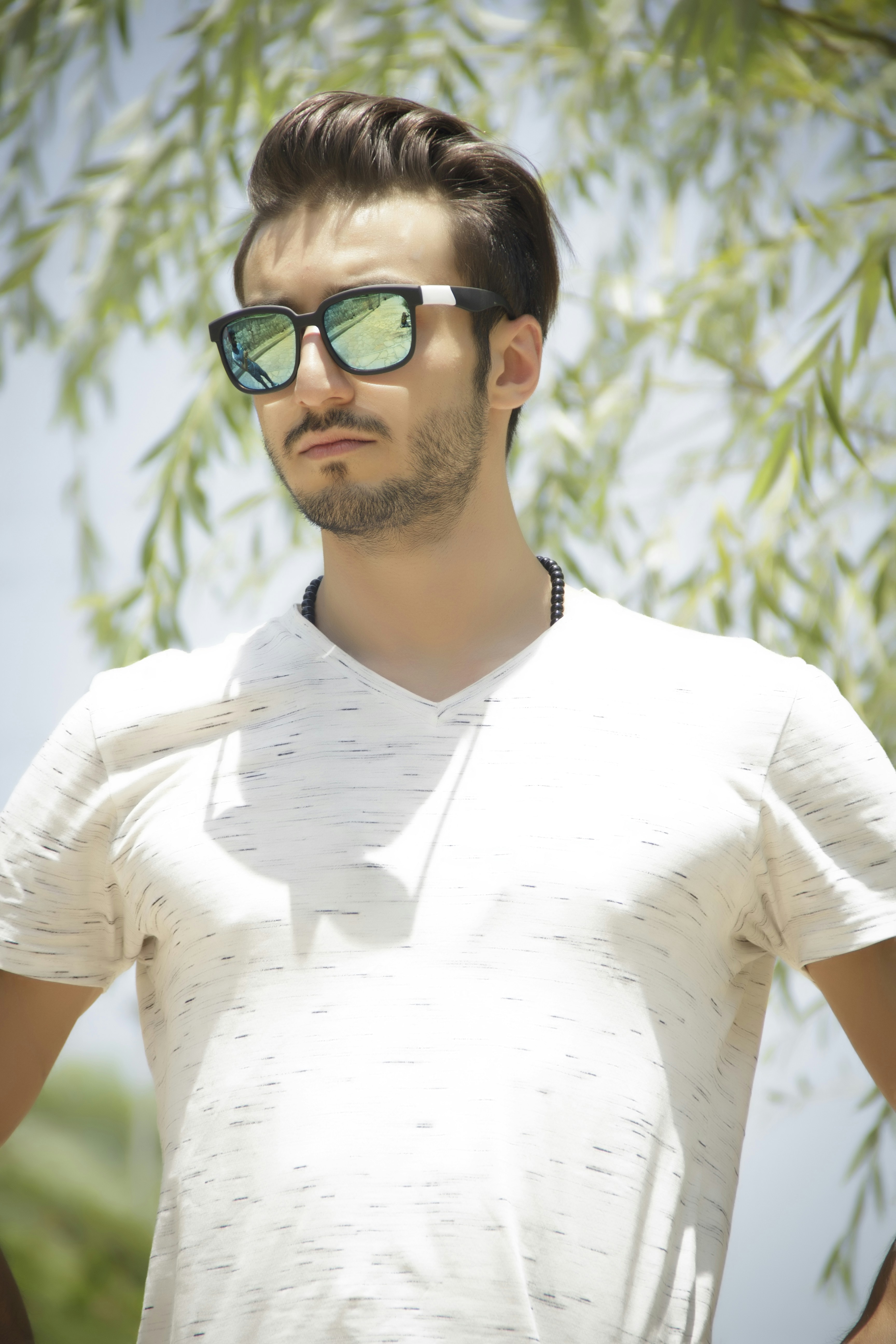 woman wearing yellow long-sleeved dress under white clouds and blue sky during daytime