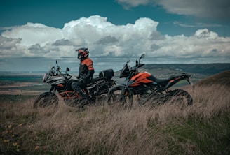 man riding on red and black sports bike
