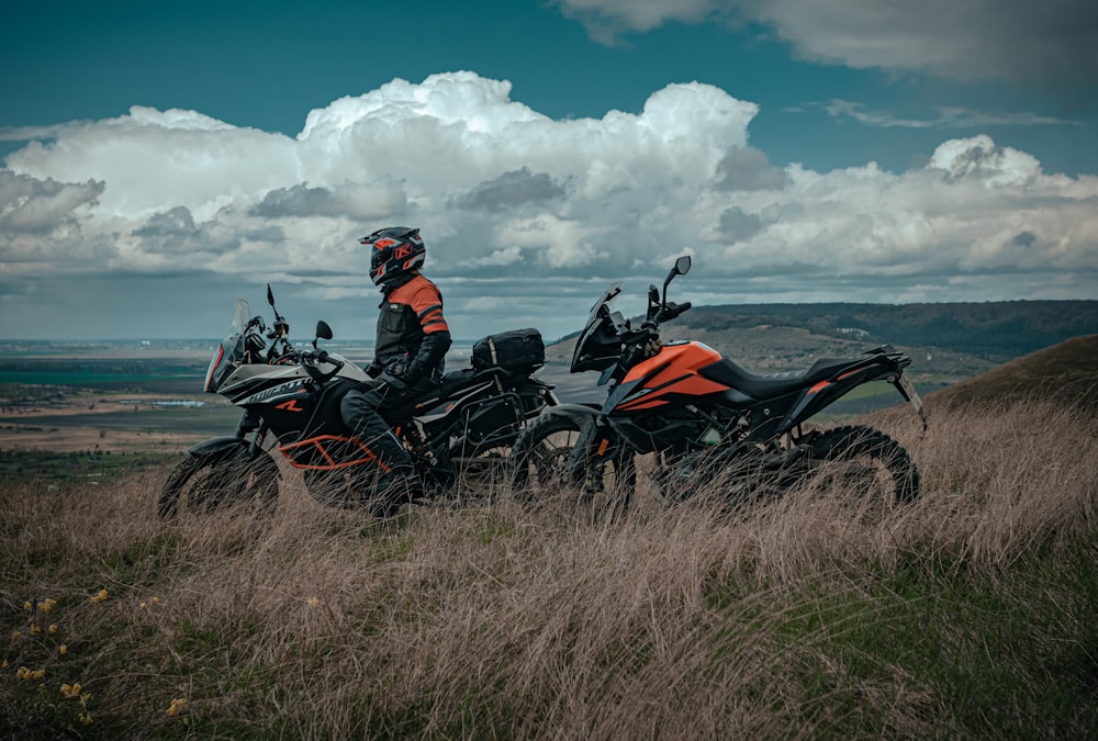 man riding on red and black sports bike