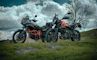 black and red sports bike on green grass field under blue sky during daytime